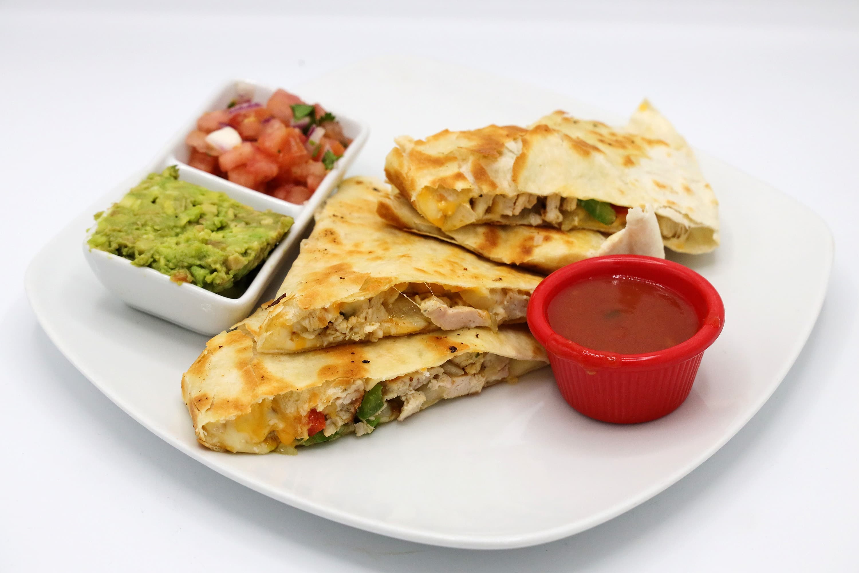 Chicken quesadilla with guacamole, pico de gallo, and salsa